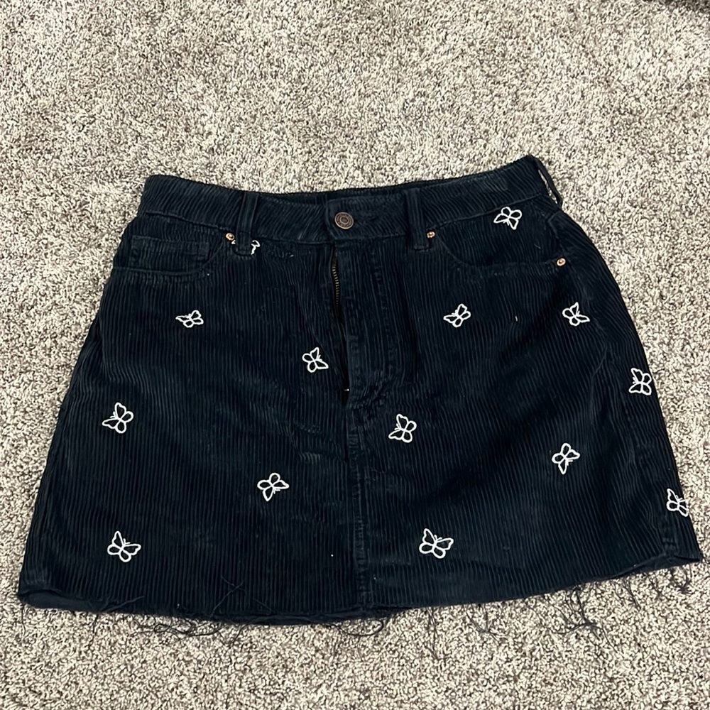 black skirt with white butterflies mini skirt with fraying at the bottom size 27